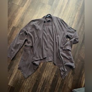 Plum colored over jacket, very light. Has zipper pockets